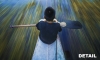 A Curripaco Tribe boy on a canoe in the Amazon Jungle