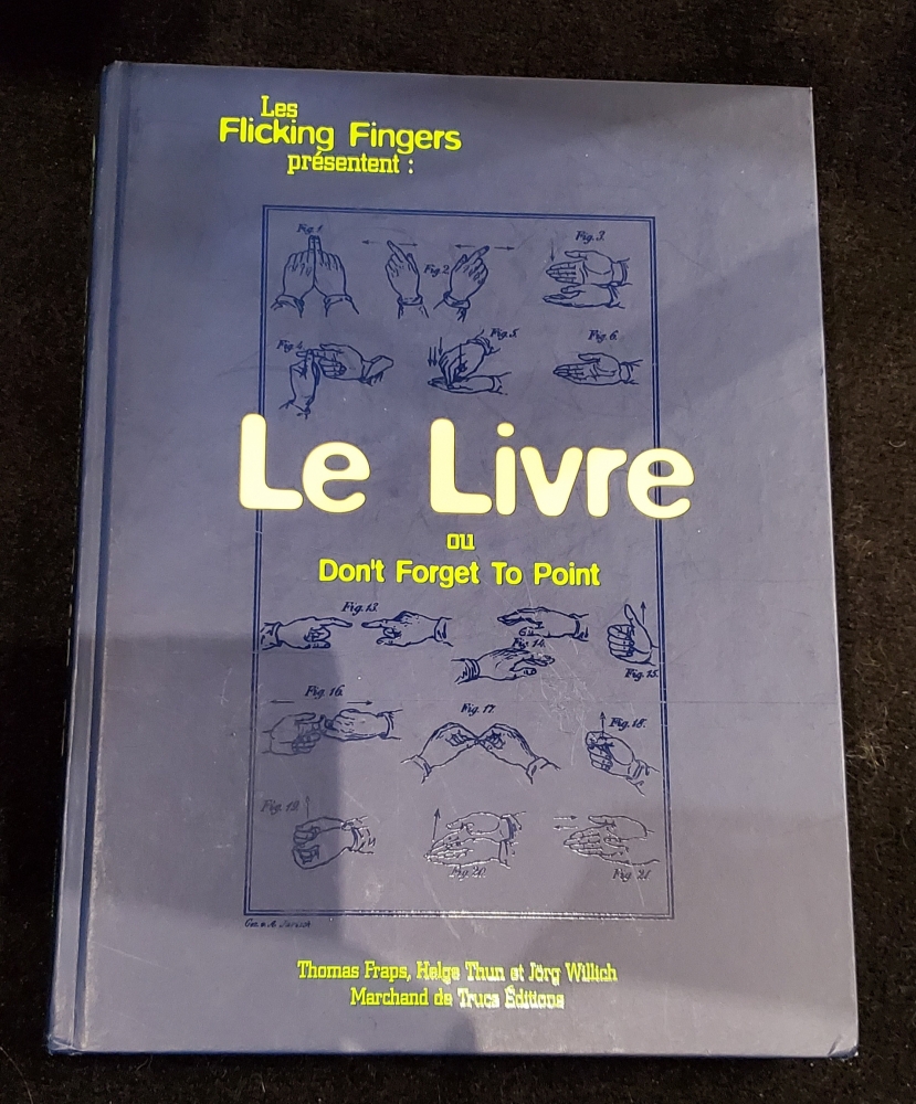 Livre de magie \"Le livre ou don't forget to point\" des Flicking Fingers