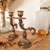 2 bougeoirs à main en régule antique
