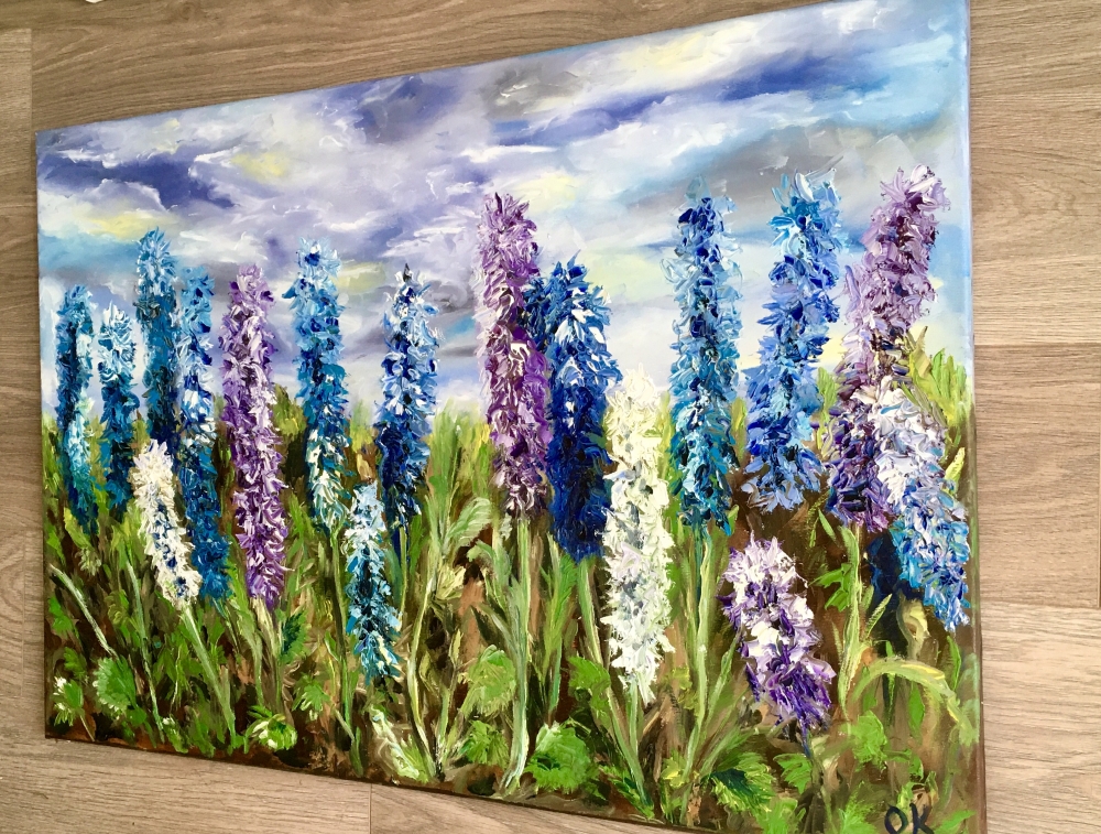 Floral art. Delphiniums in a park. Wild flowers.