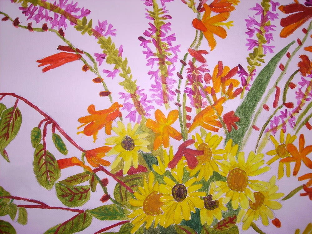 A Mixture of flowers in a two coloured vase.