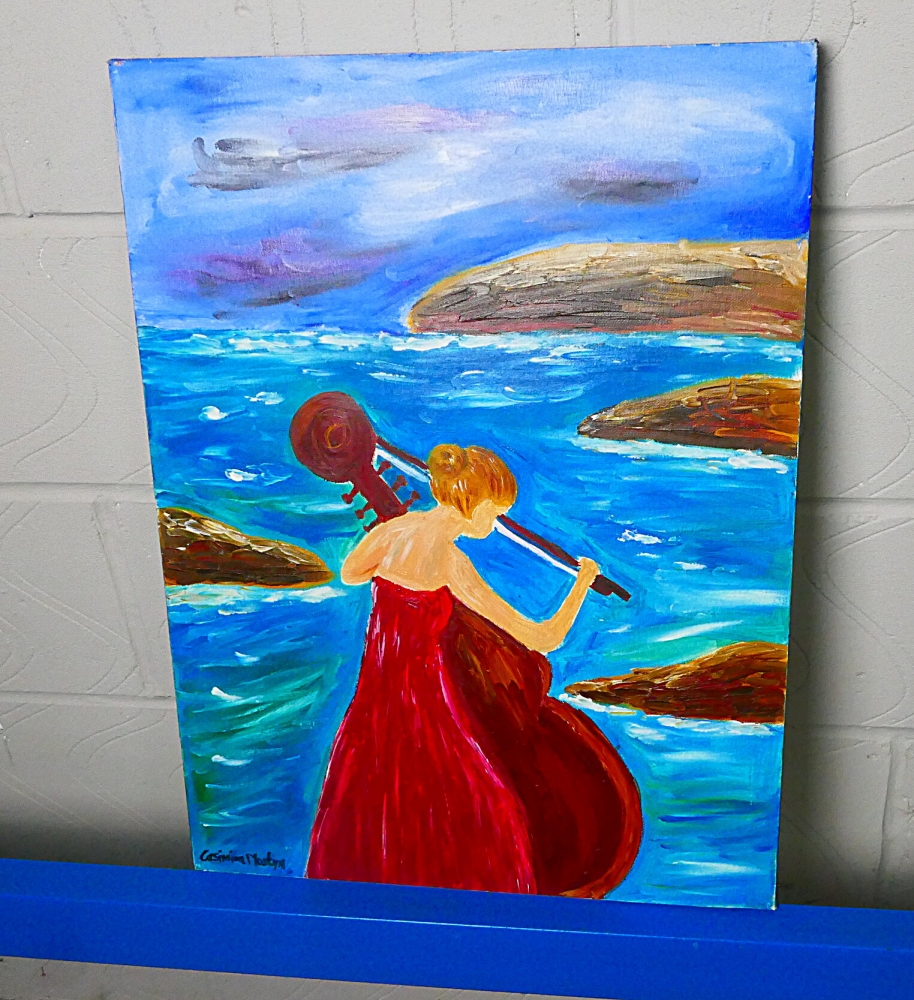 Playing her Cello in Her Red Dress by the Sea