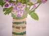 flowers in a striped pottery vase