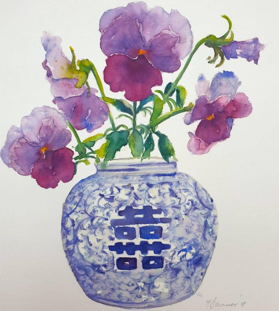 Oriental blue & white vase of purple pansies