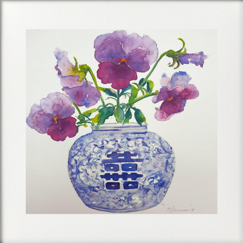 Oriental blue & white vase of purple pansies