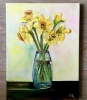 Bouquet of daffodils #3 in a glass on the wooden table. 