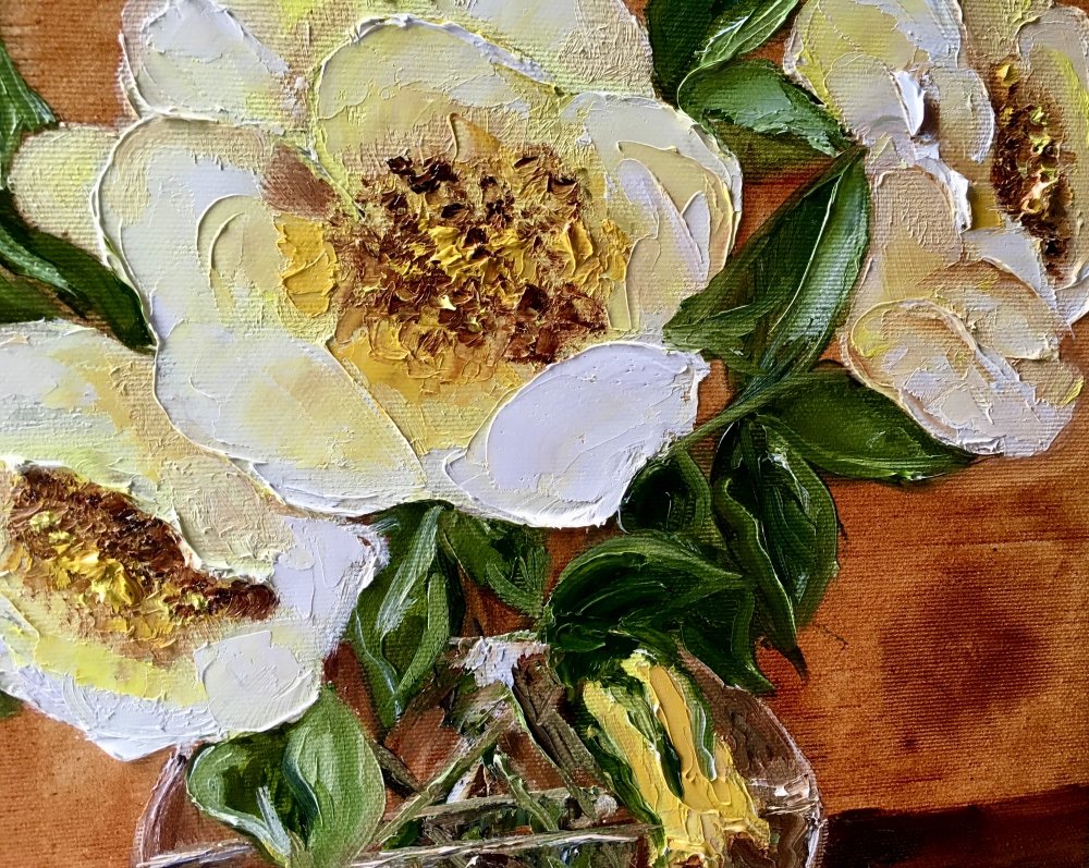 Bouquet of wild yellow roses in a vase on wooden table