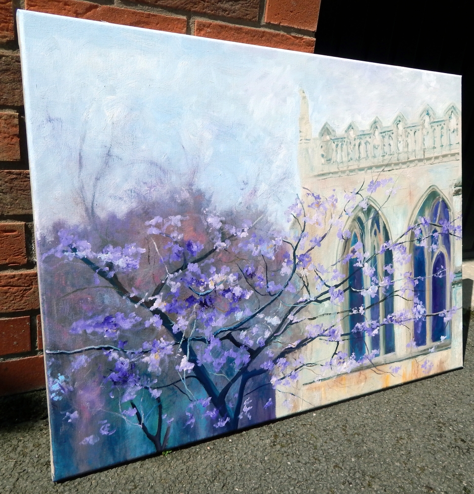 Peterborough cathedral with purple blossom tree