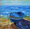 Blue boat on seashore