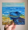 Blue boat on seashore