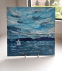 Seascape with white sailboat