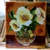 Bouquet of wild yellow roses in a vase on wooden table