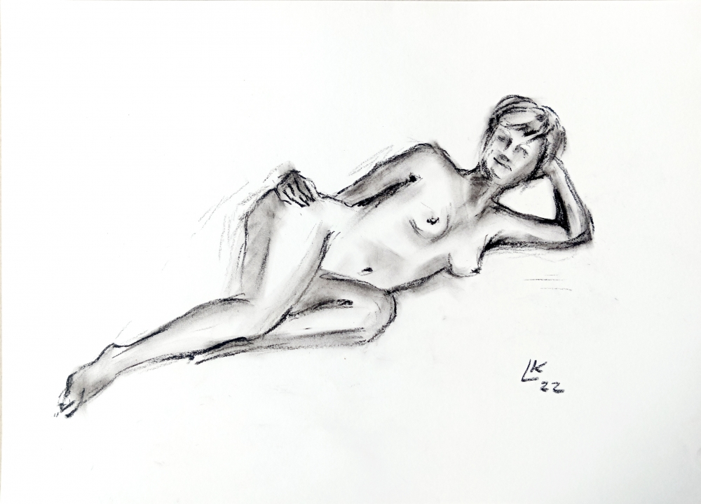 Nude woman is laying