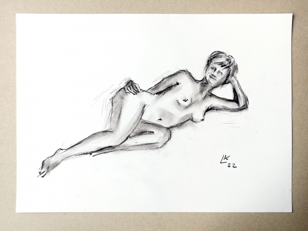 Nude woman is laying