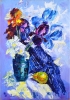 Bouquet of irises in a vase and yellow pear