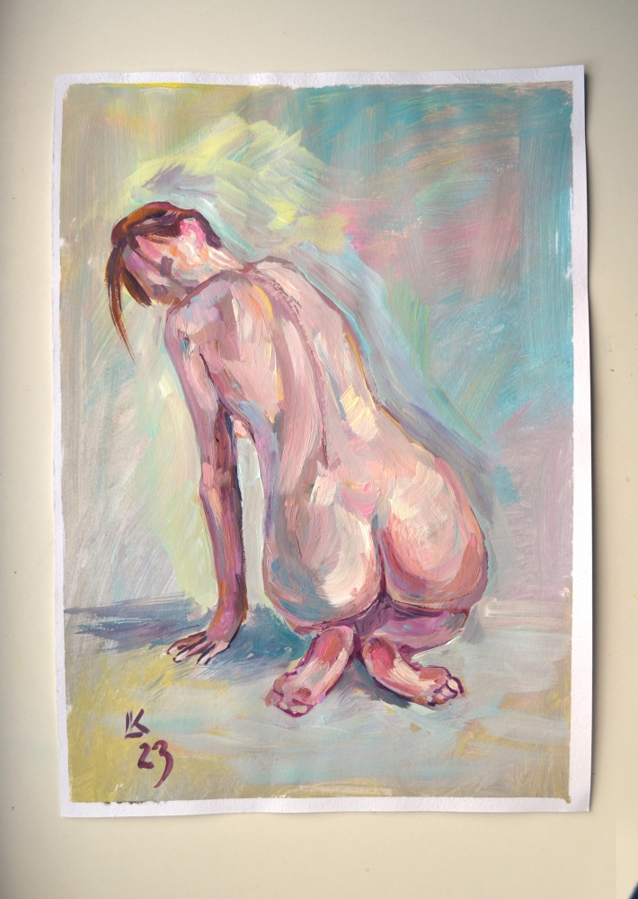 Nude woman sitting back