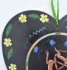 Hares with primroses on a heart 