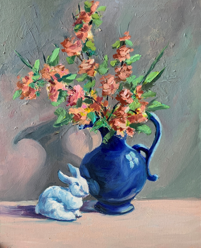 Blue vase with flowers and rabbit.