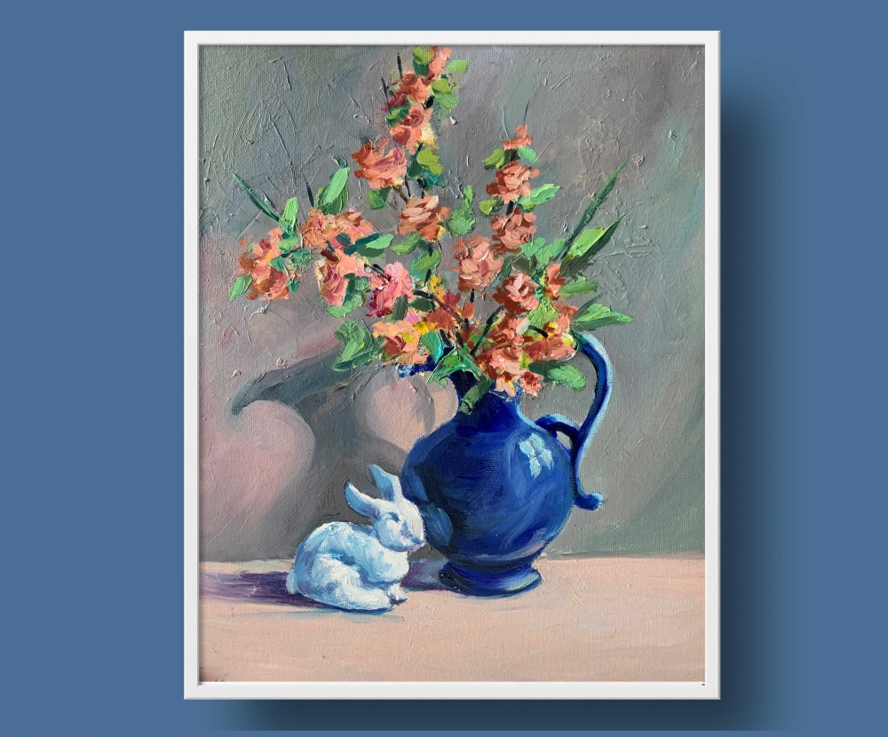 Blue vase with flowers and rabbit.