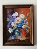 Bouquet of White flowers in a blue vase on red. Still life.