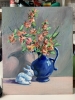 Blue vase with flowers and rabbit.