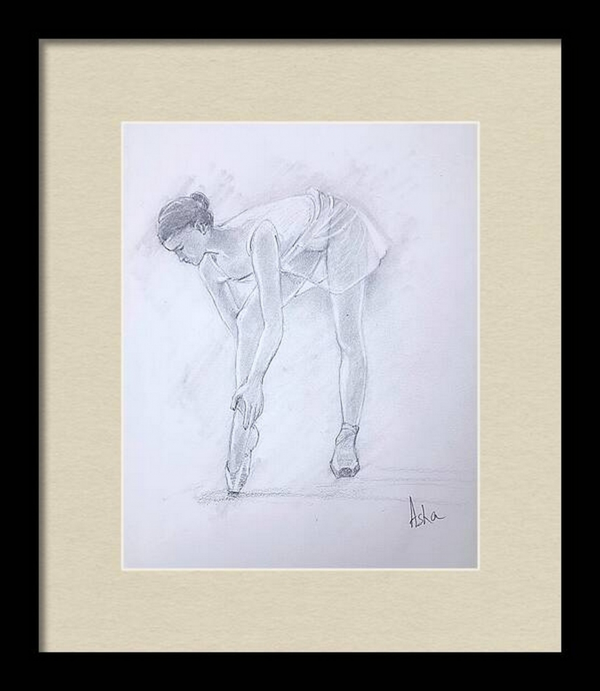 Ballerina adjusting her shoe