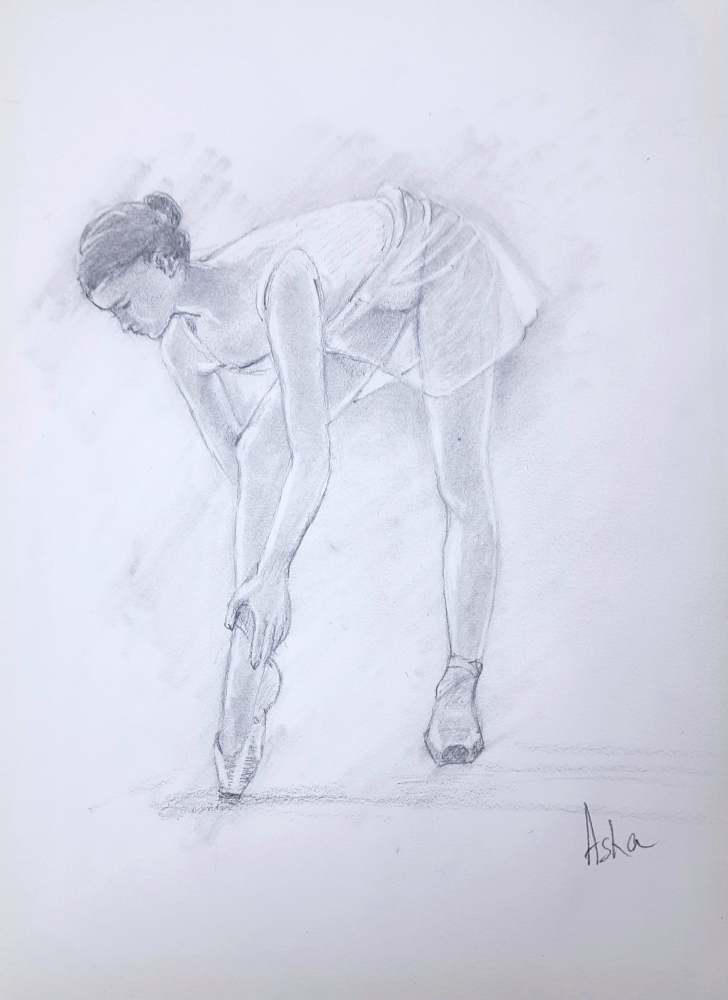 Ballerina adjusting her shoe