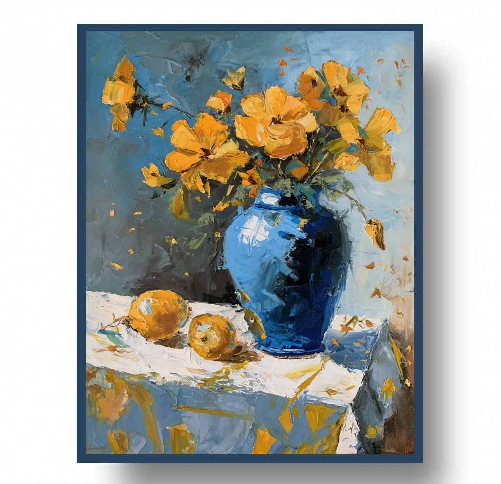 Yellow wild flowers in a blue vase.