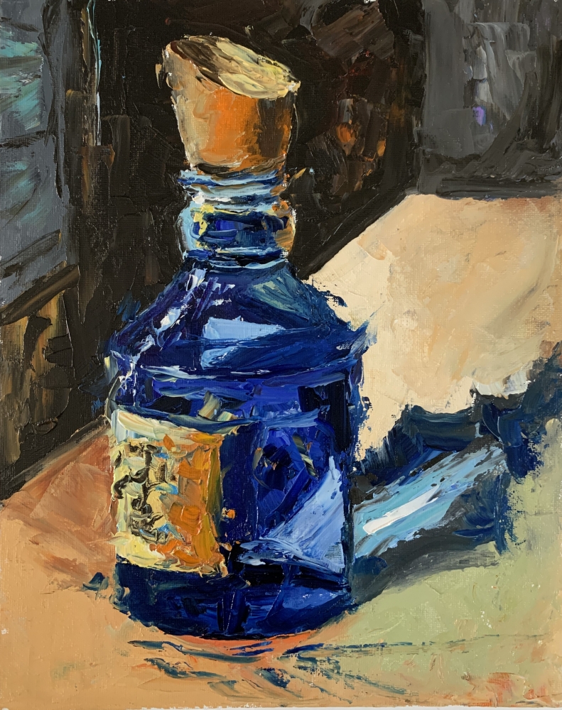 Mystery blue glass bottle, still life.