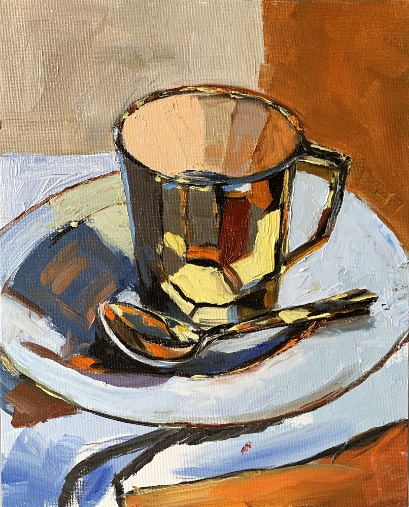 Gold tea cup. still life