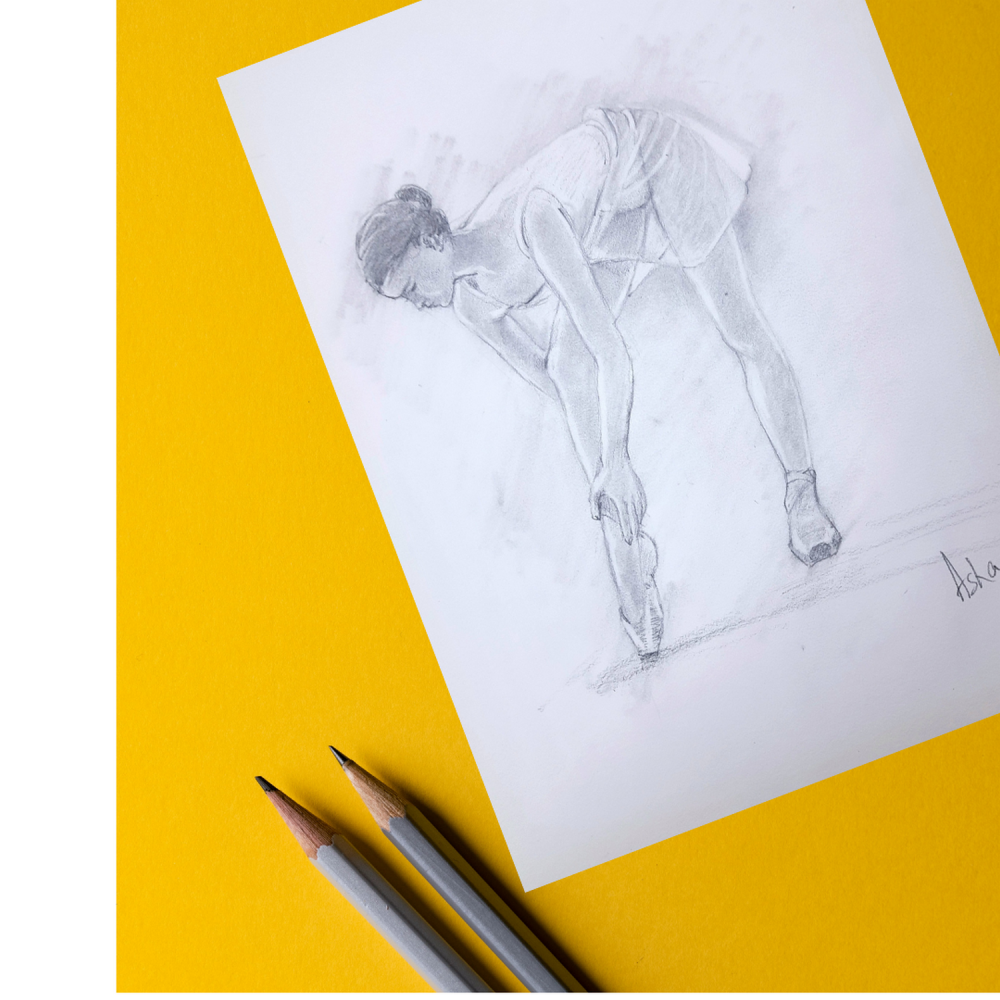 Ballerina adjusting her shoe