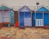 Red kayak and beach huts