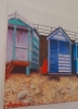 Red kayak and beach huts