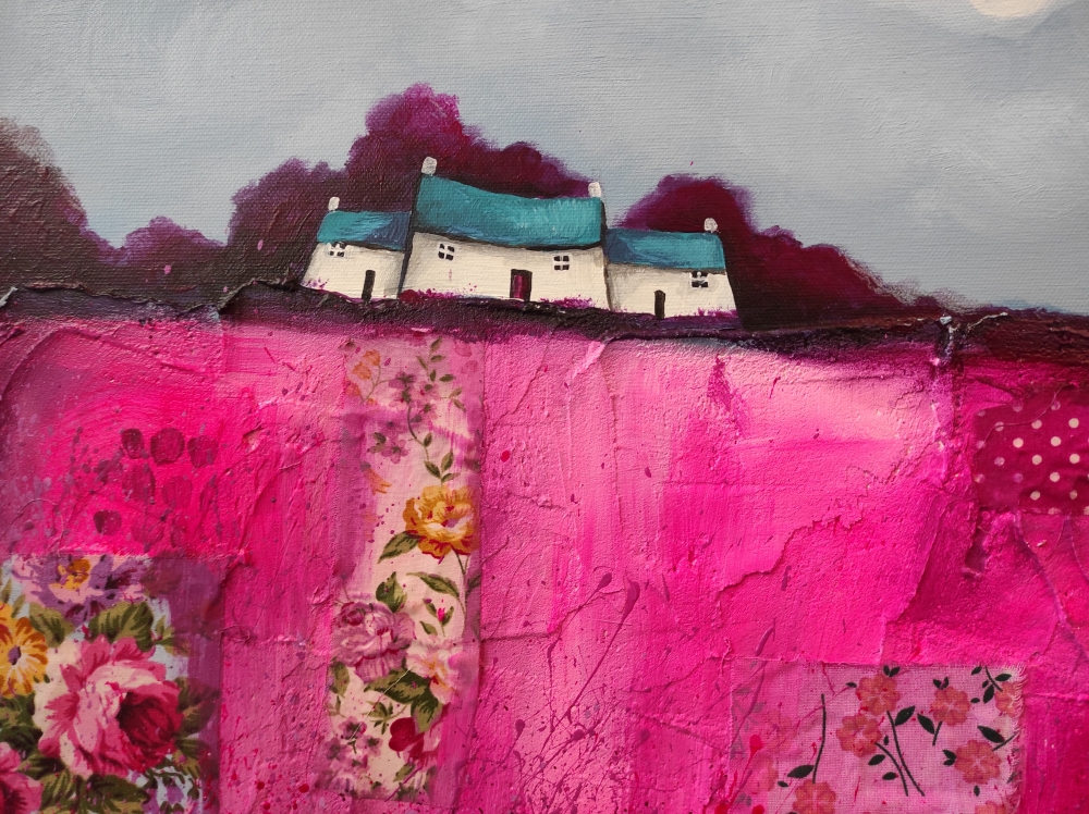 Houses on magenta pink patchwork fields 