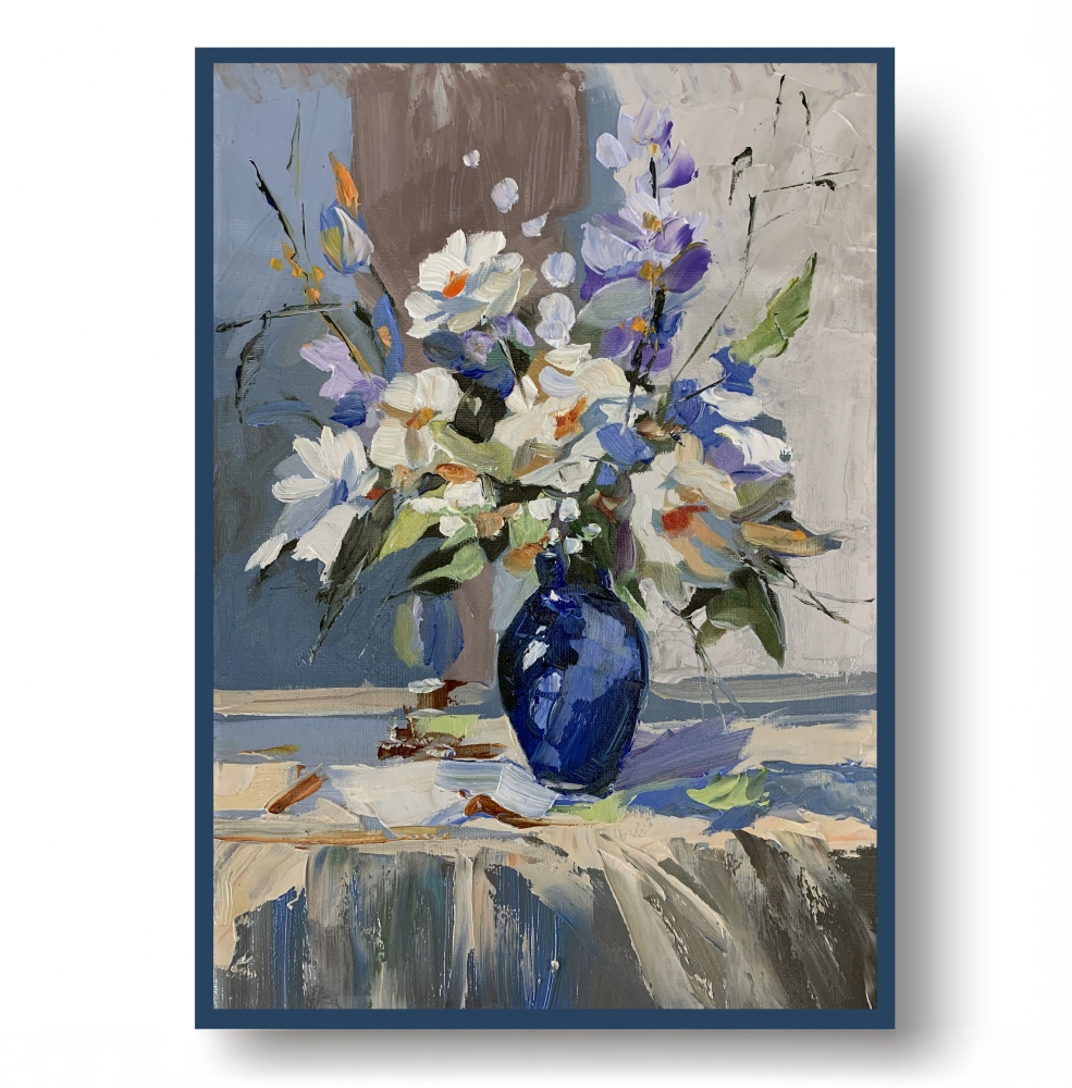 White flowers in a blue vase.