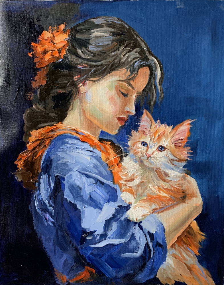 Girl in blue dress with orange cat