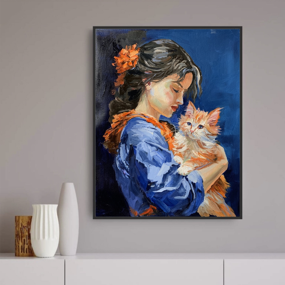 Girl in blue dress with orange cat