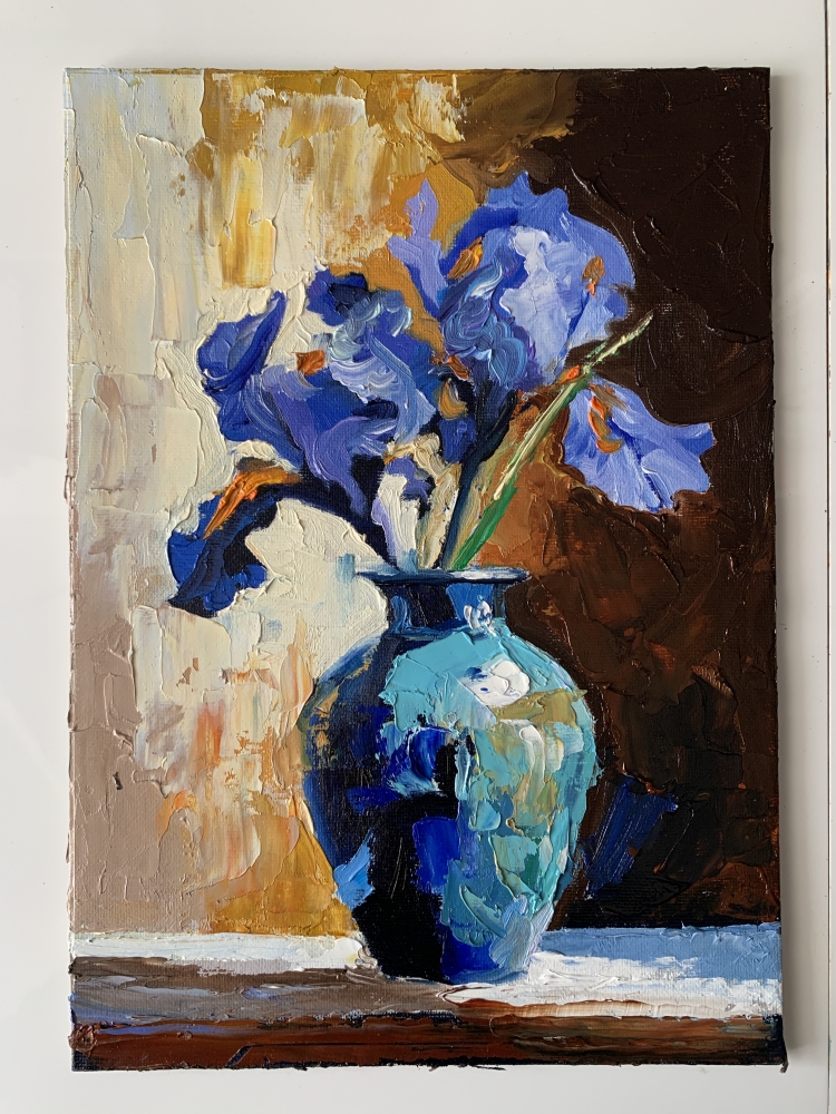 Blue irises in a vase. Fr.