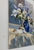 White flowers in a blue vase.