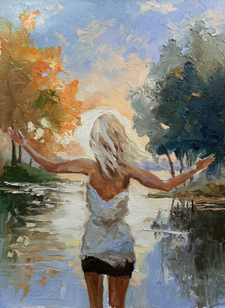 Greeting sunset. Woman by the lake.