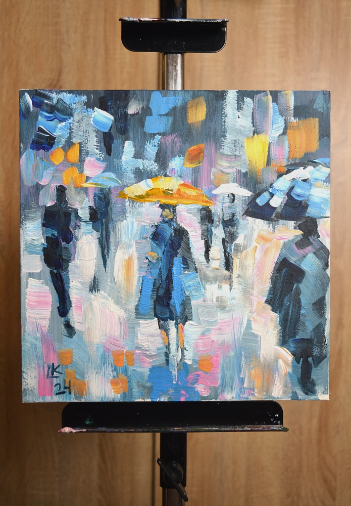 People with Umbrellas in the Rain on a Colorful City Street