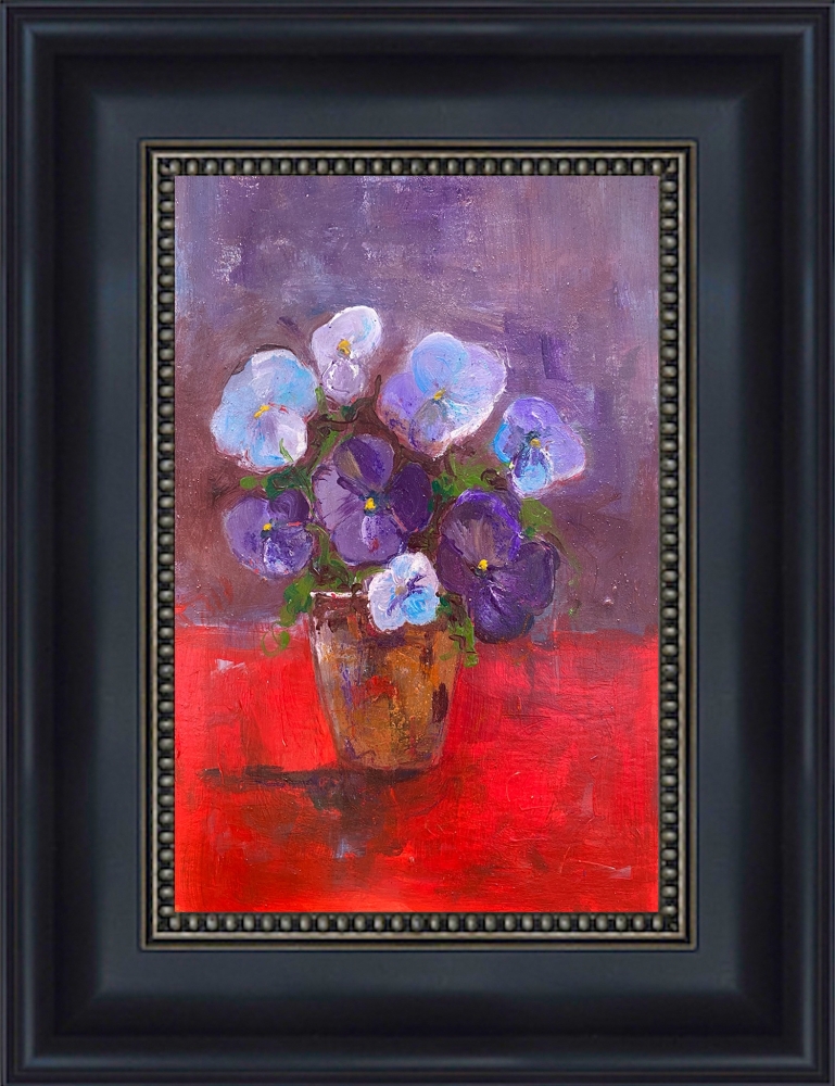 Vase of purple pansies