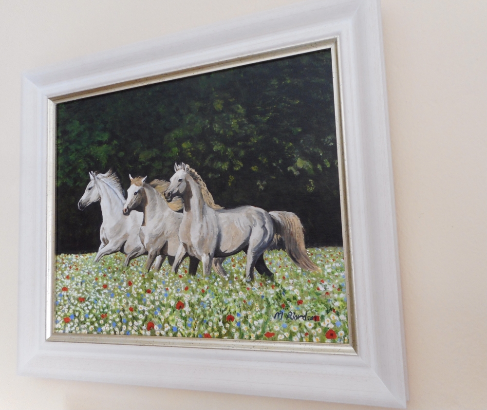 Horses in wildflower meadow
