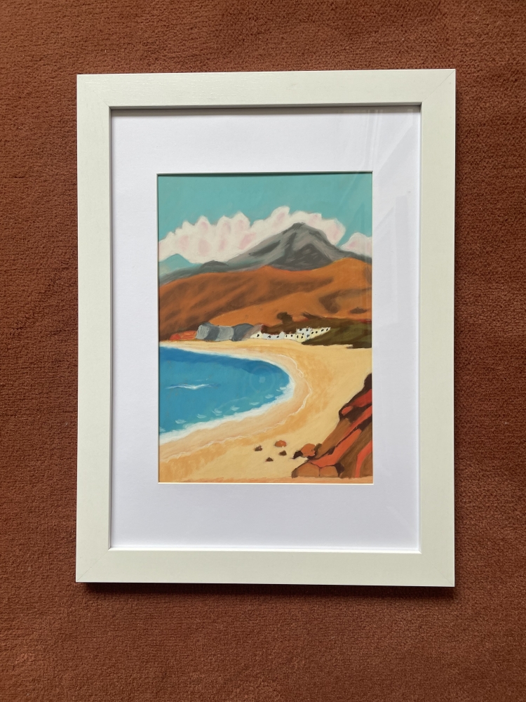 Quiet beach sheltered by mountains 