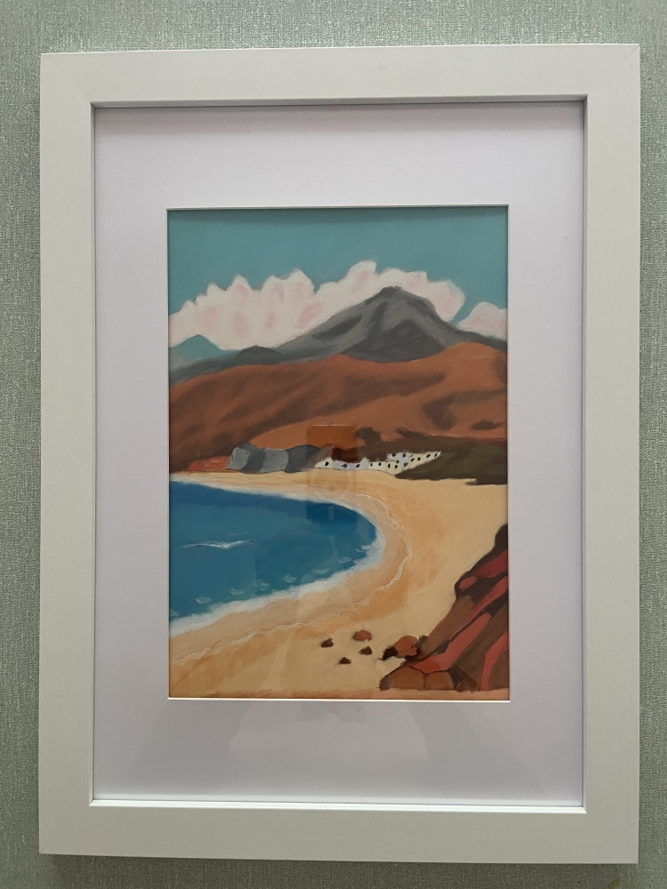 Quiet beach sheltered by mountains 