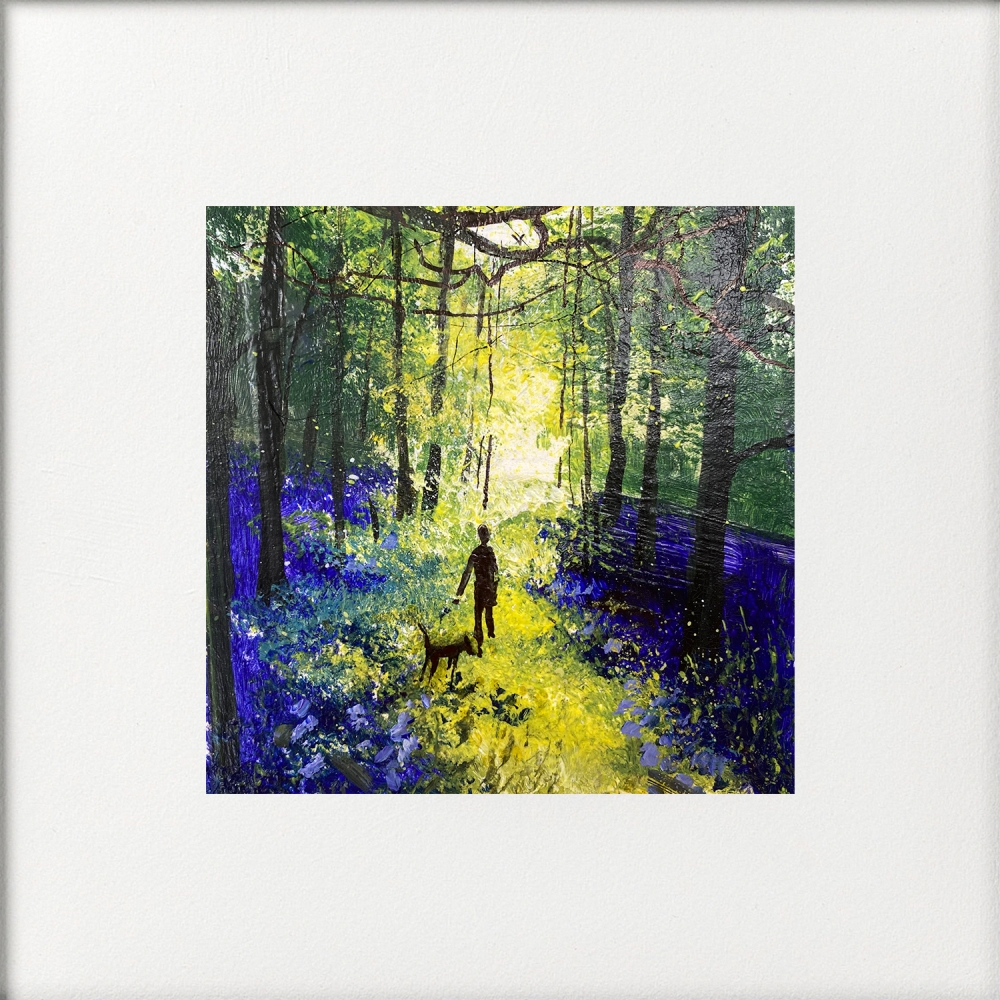 Walk with dog among bluebells