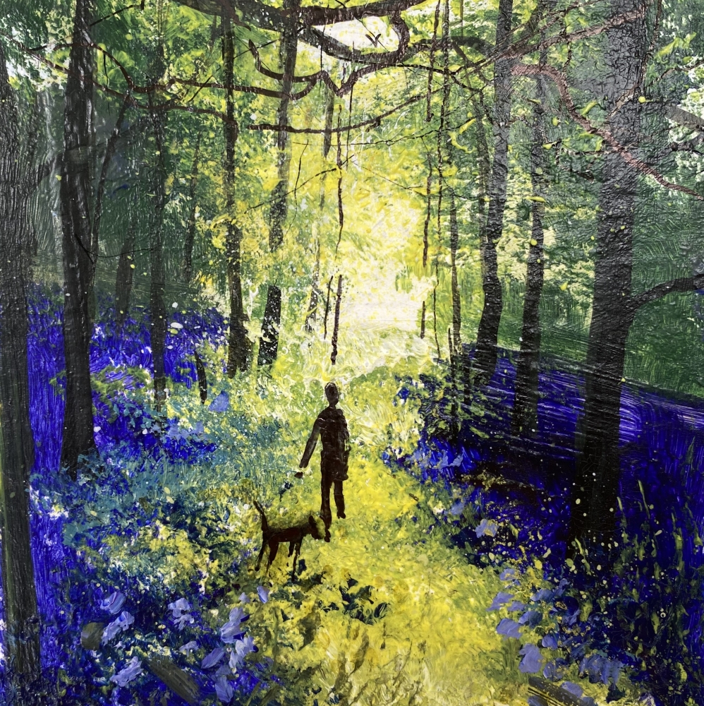 Walk with dog among bluebells