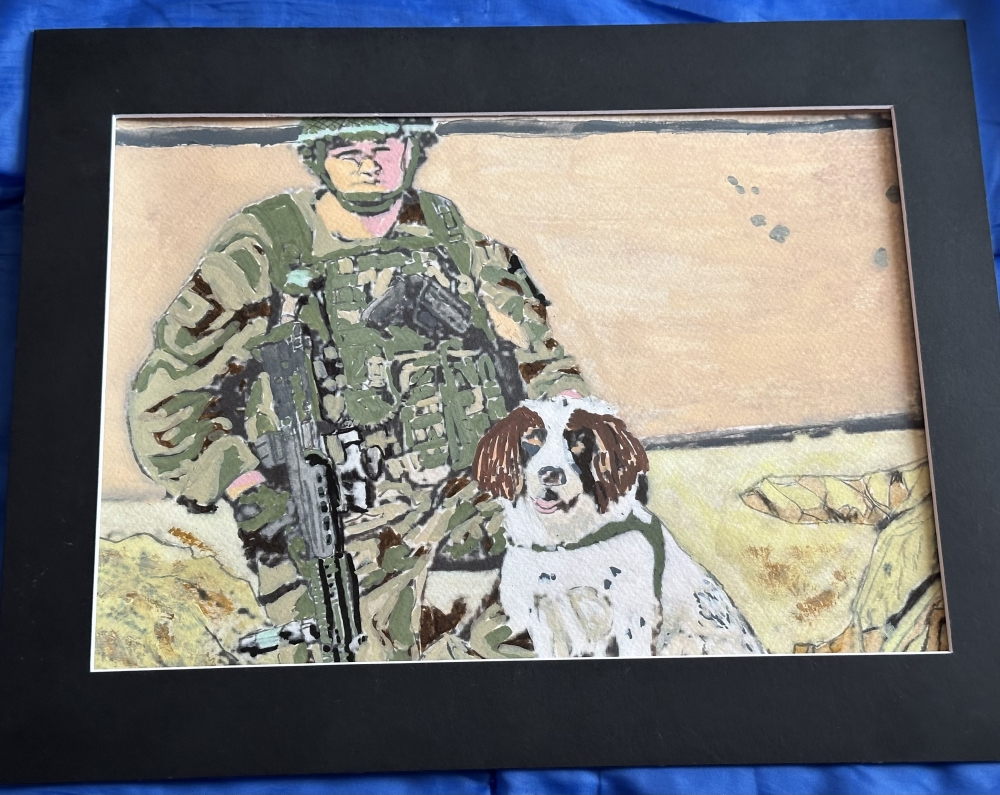 Military dog handler with snifffer cocka spaniel called Jess