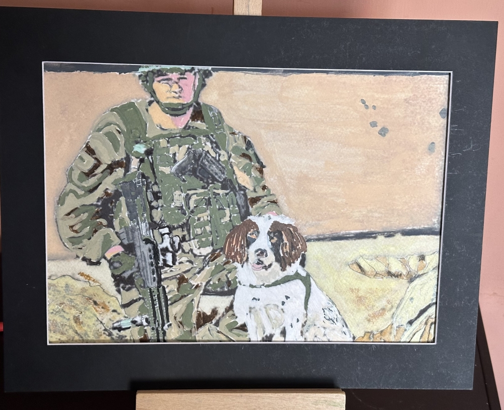 Military dog handler with snifffer cocka spaniel called Jess