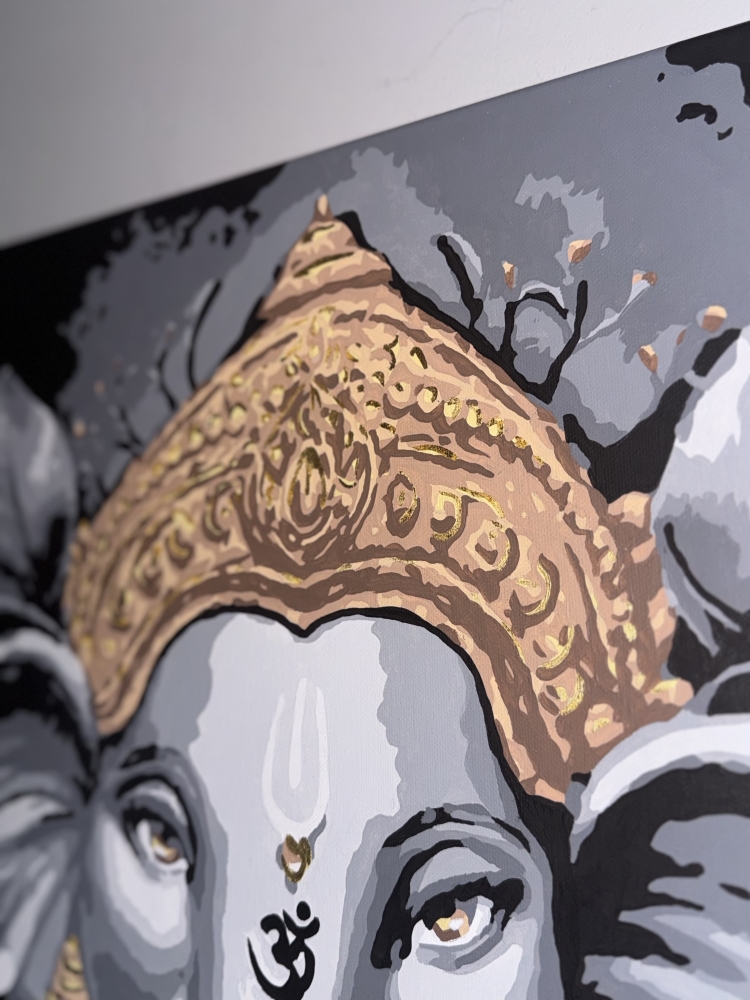 Divine Presence: Ganesha in Gold and Grace